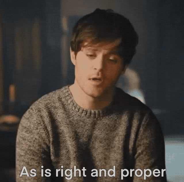 a man wearing a grey sweater says as is right and proper