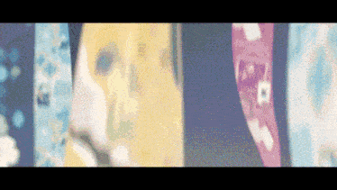a blurred image of a row of different colored objects