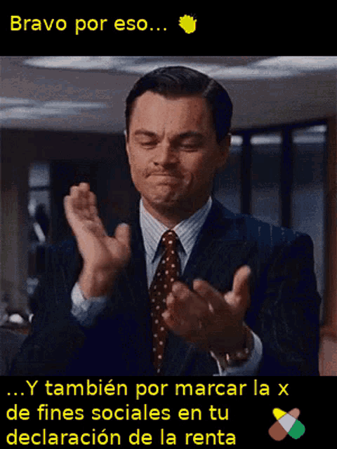 a man in a suit and tie is clapping his hands with the words bravo por eso written above him