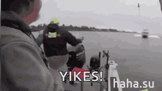 a man on a boat with the words yikes written on it