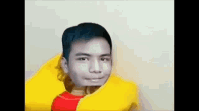 a young man is wearing a yellow life preserver with his head sticking out of it .