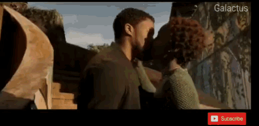 a man and woman kissing in front of a sign that says " galactus "