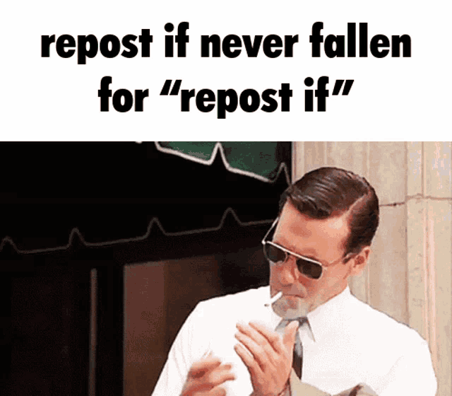 a man in a suit and tie is smoking a cigarette with the caption " repost if never fallen for " repost if "