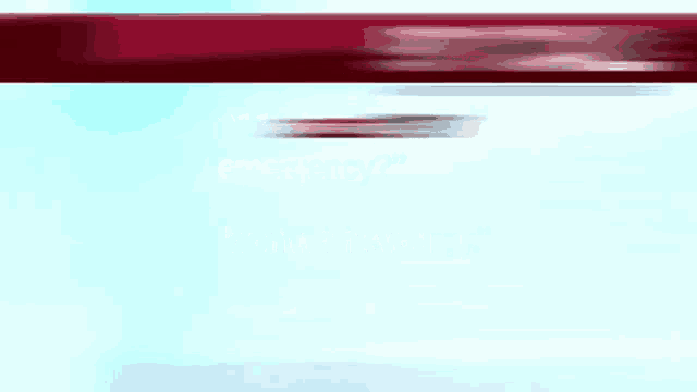 a blurred image of a red object on a blue background .