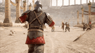 a man in armor is walking in the desert