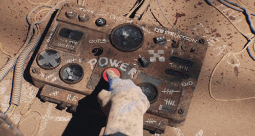 a person is pressing a button on a device that says power
