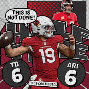 a cardinals football player is holding a football in his hand