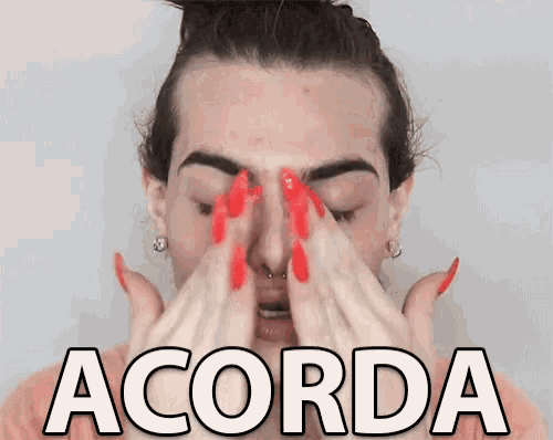 a woman with red nails is covering her eyes with her hands and the word acorda is above her