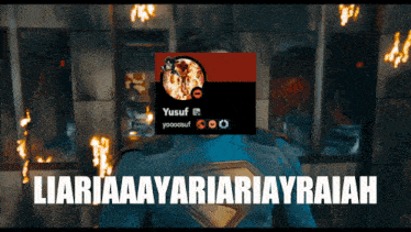 a man in a superman costume is standing in front of a sign that says yusuf on it
