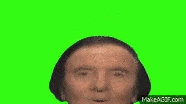 a man with a surprised look on his face on a green screen .