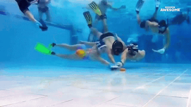 a group of people are swimming in a pool with the words awesome on the bottom of the screen