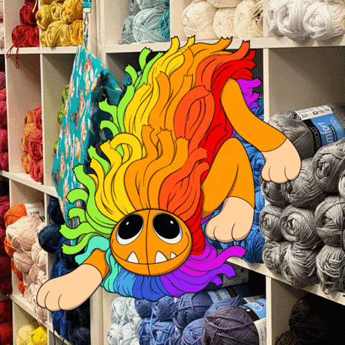 a cartoon drawing of a lion with a rainbow mane is surrounded by yarn balls