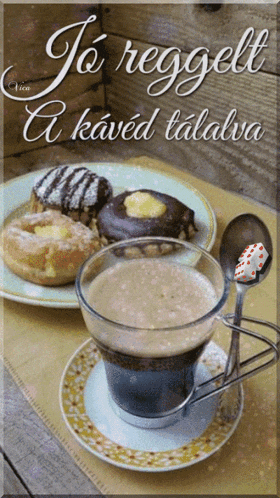 a cup of coffee is on a saucer next to a plate of pastries