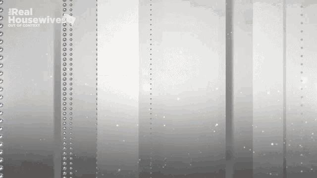 a gray background with a real housewives logo on the bottom