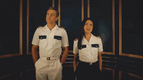 a man and a woman are standing next to each other