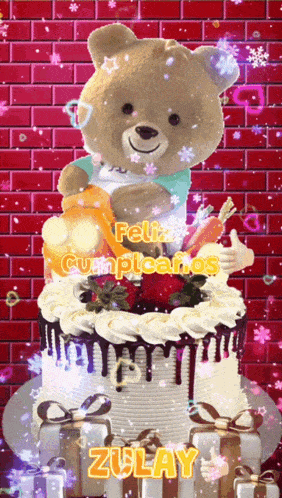a teddy bear on top of a cake that says feliz cumpleaños zulay