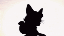 a silhouette of a cartoon character with a star on his head and a ponytail .