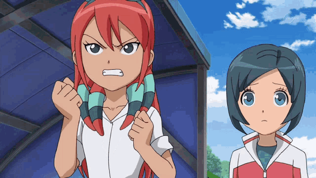 a girl with red hair is standing next to another girl