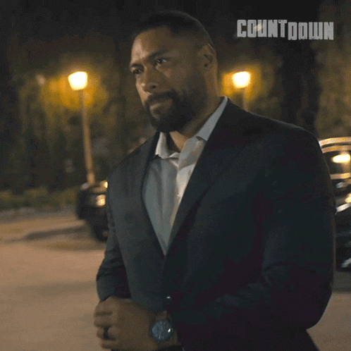 a man in a suit with the word countdown on the bottom