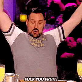 a man with his arms in the air says fuck you fruit