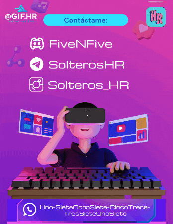 a man wearing a virtual reality headset sits at a computer keyboard