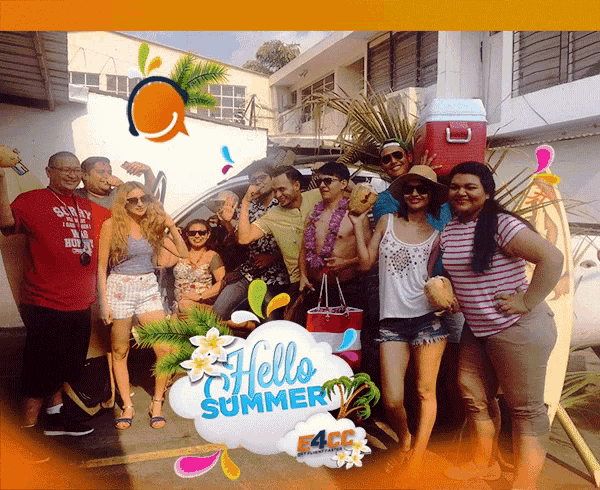 a group of people are posing for a picture with a hello summer sign