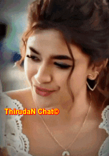 a close up of a woman wearing a necklace with the words thiruda n chat on the bottom