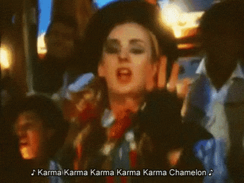 a woman singing a song called karma karma karma karma karma chamelon