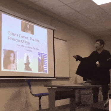 a man giving a presentation on selena gomez the new princess of pop