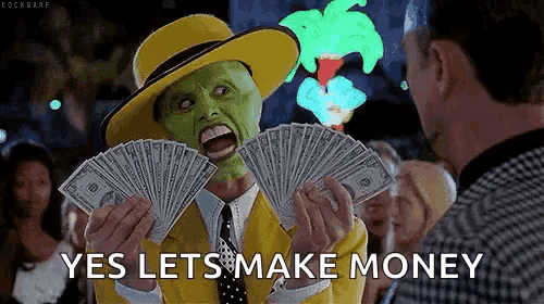 a man in a yellow hat and mask is holding a fan of money and saying yes lets make money .
