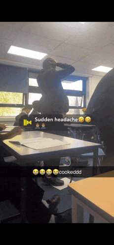 a group of people in a classroom with sudden headache