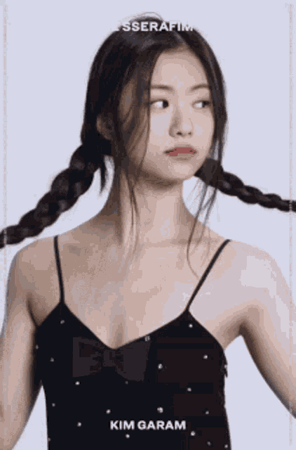 a woman in a black dress with braids has the name kim garam on the bottom
