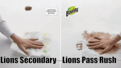 a bounty ad shows a person 's hands on a lion 's pass rush
