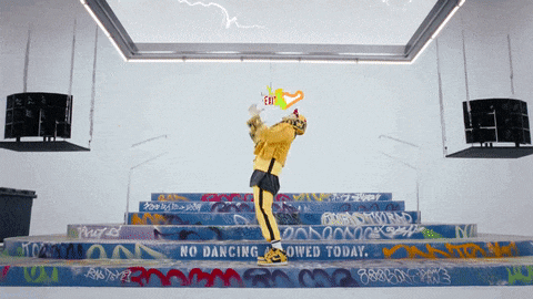a person standing on a set of stairs with graffiti on them that says " no dancing allowed today "