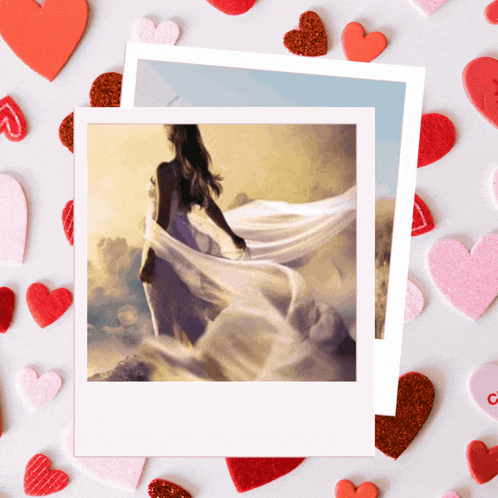 a picture of a woman in a white dress surrounded by red and pink hearts