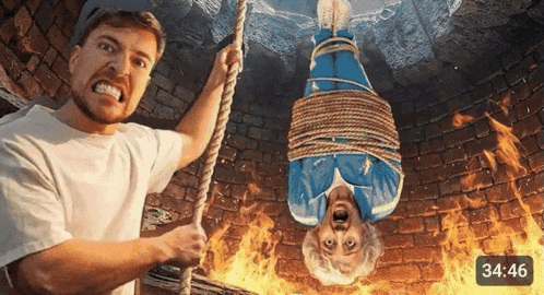 a man is holding a rope while a woman is tied up in a well