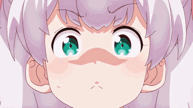 a close up of a girl 's face with a shocked look on her face