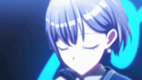 a close up of a girl with her eyes closed and a blue background .
