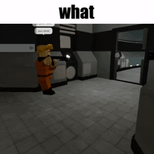 a man in an orange uniform is holding a gun in a room with the word what above him