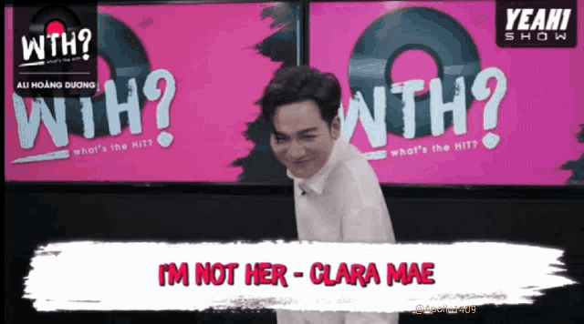 a man is standing in front of a sign that says yeah show