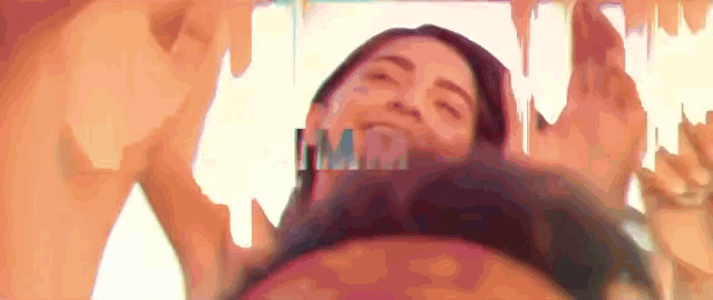 a woman 's face is shown in a blurry photo with the word hmm visible