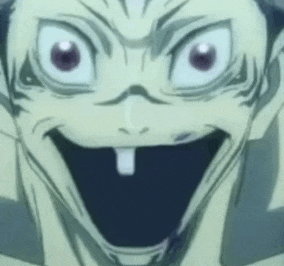 a close up of a person 's face with their mouth open and a tooth sticking out .