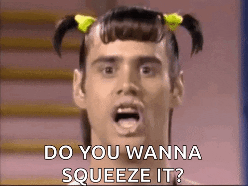 a man with pigtails is asking do you wanna squeeze it ?