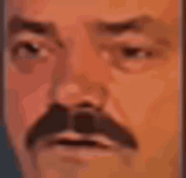 a close up of a man 's face with a mustache and a surprised look on his face .