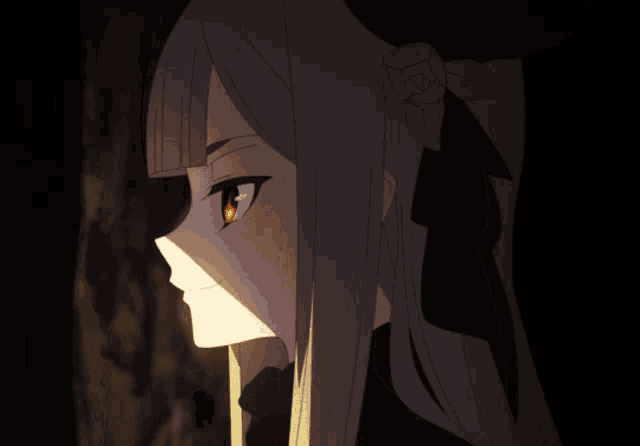 a girl with long hair and red eyes is standing in the dark
