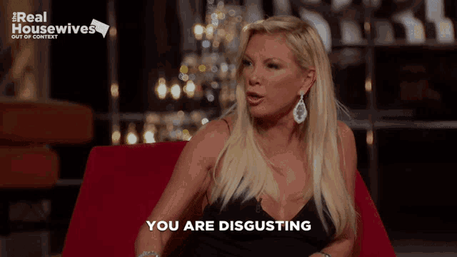 a woman sitting in a chair with the words you are disgusting written on the bottom