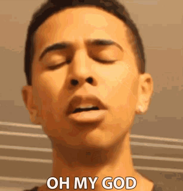 a young man with his eyes closed and the words oh my god on his face