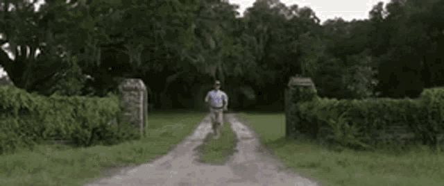 a man is running down a dirt road with the words chaag islam written on the bottom