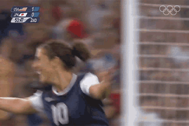 a female soccer player wearing a number 10 jersey