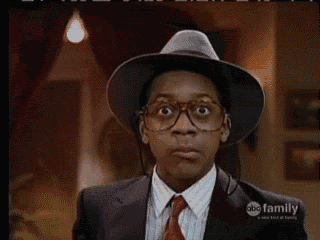 a man wearing glasses and a hat with abc family on the bottom